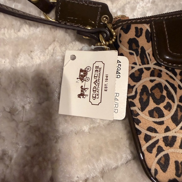Coach Black and Tan Animal Print Wristlet - Picture 7 of 9